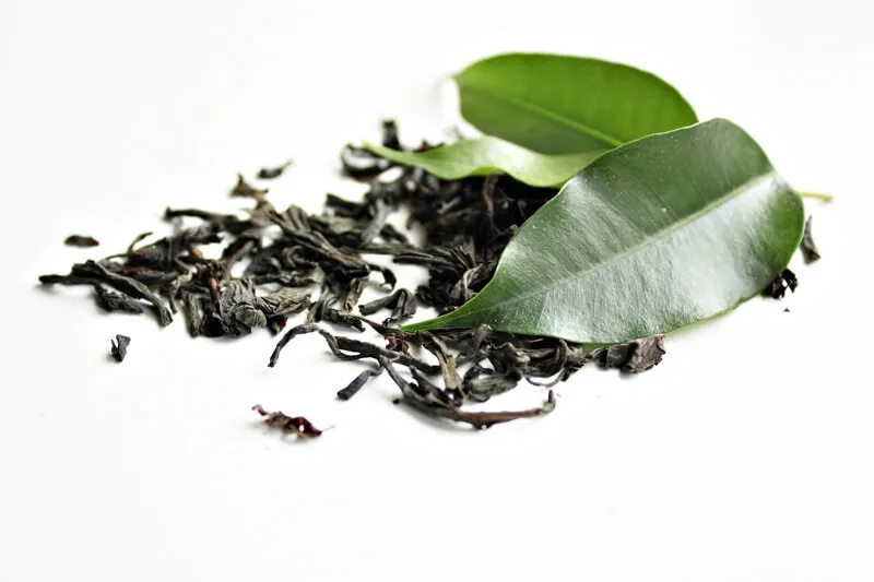 Tea bags and loose tea leaves, sources of caffeine that are toxic to dogs.