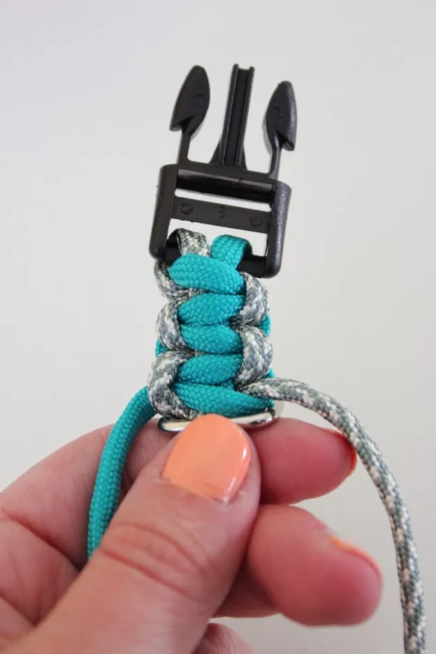 The left cord is pulled through the center of the &quot;p&quot; to complete this weave loop.