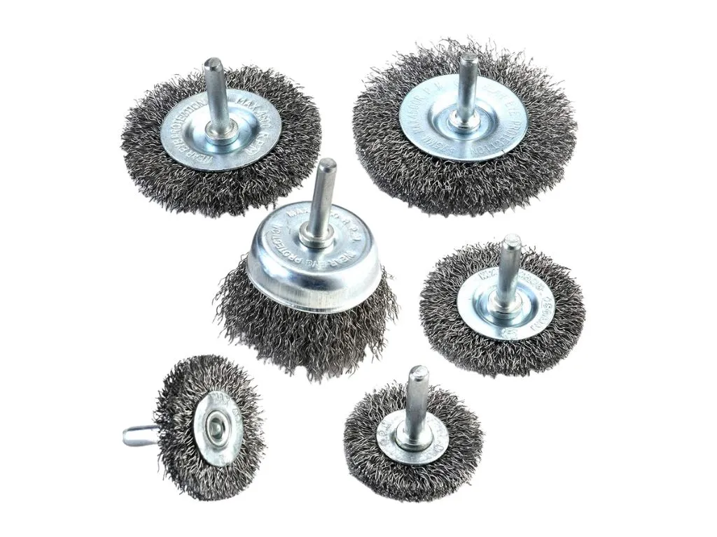 Using a wire brush to remove stubborn dog hair from car carpet