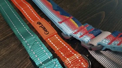 Various reflective dog collar materials captured in low light, demonstrating the differences in their reflectivity levels.