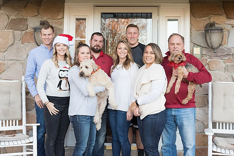 Yorkiepoo, Sophie, an integral part of the family, sharing in the joy of graduation.