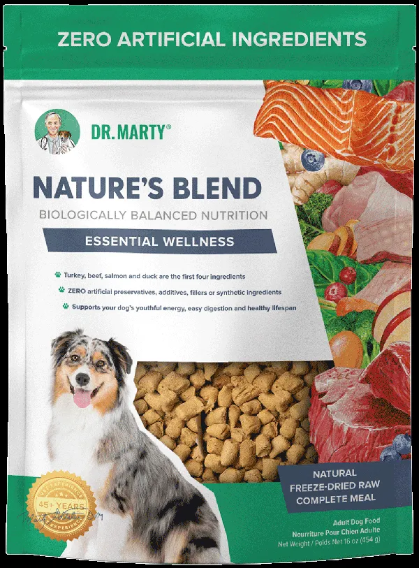 A bag of Dr. Marty Nature's Blend dog food next to a bowl of the freeze-dried raw kibble.