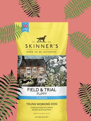 A bag of Skinner's Field & Trial dry puppy food with a puppy bowl.