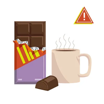 A bar of dark chocolate broken into squares, with some smaller chocolate pieces scattered around.