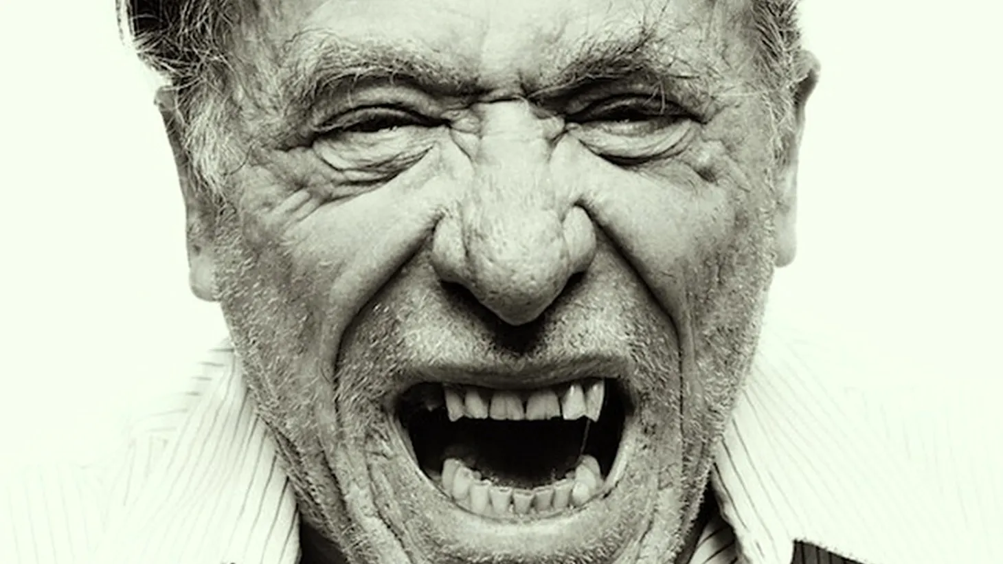 A black and white photograph of Charles Bukowski with a snarl on his face, smoking a cigarette