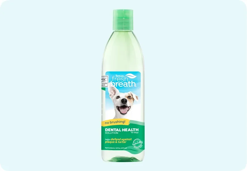 A bottle of TropiClean Fresh Breath Water Additive, highlighting its natural ingredients.