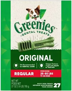 A close-up of green X-shaped dental chews for dogs