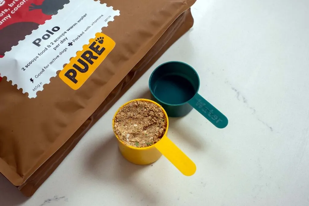 A close-up of Pure Pet Food with visible vegetables, highlighting its natural ingredients.