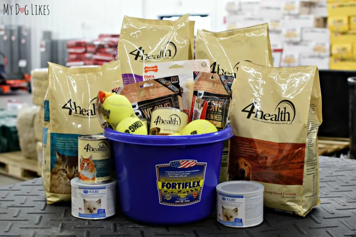 A collection of donated pet food and treats from Tractor Supply