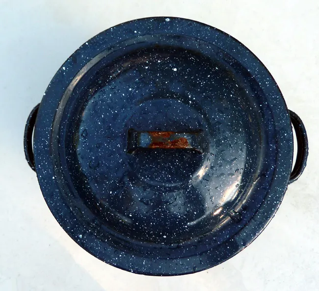 A collection of various sized Kong dog toys, some with caps covering their openings, ready for stuffing and play