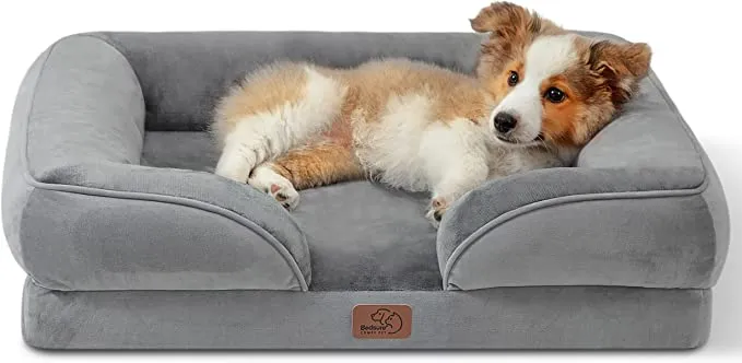 A cozy, round dog bed made of soft, light-colored material, suitable for a small puppy