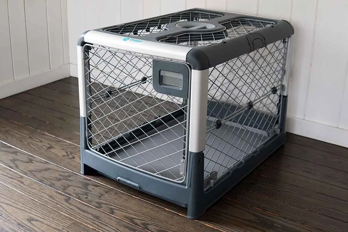 A Diggs Revol dog crate in its collapsed state, highlighting its portability.