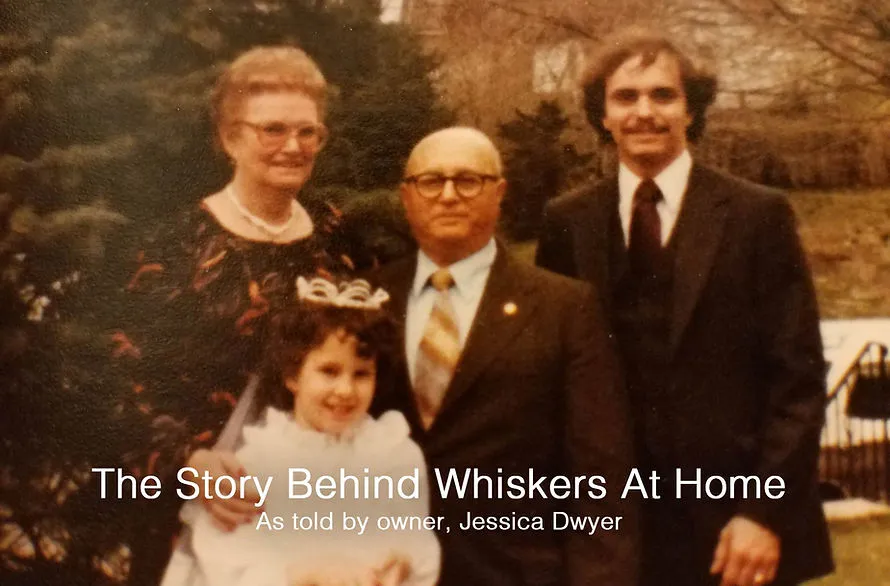 A family photo with three people and two cats, illustrating a deep love for felines