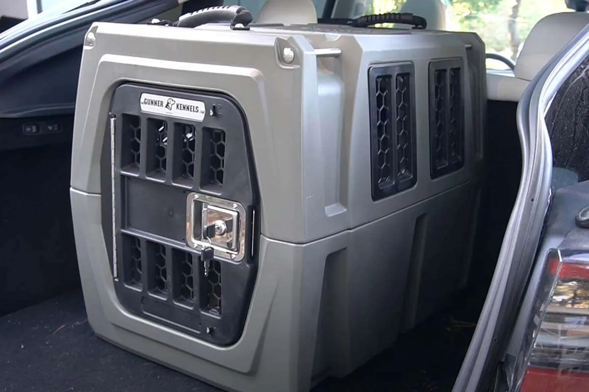 A Gunner G1 Kennel (medium size) securely placed in the trunk of a Tesla Model Y