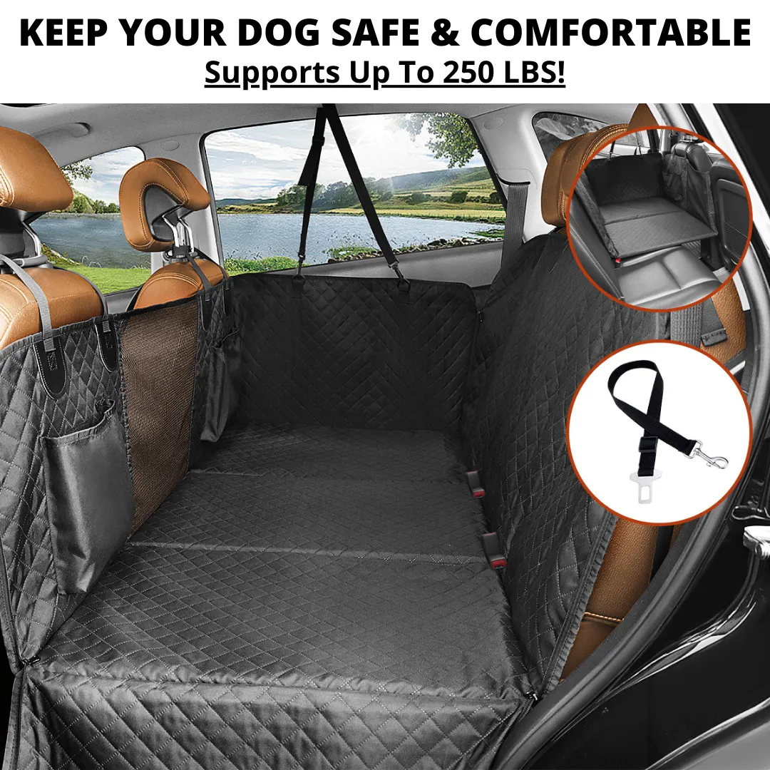 A happy golden retriever dog is comfortably seated in a Team K9 car seat cover, looking out the front mesh window.