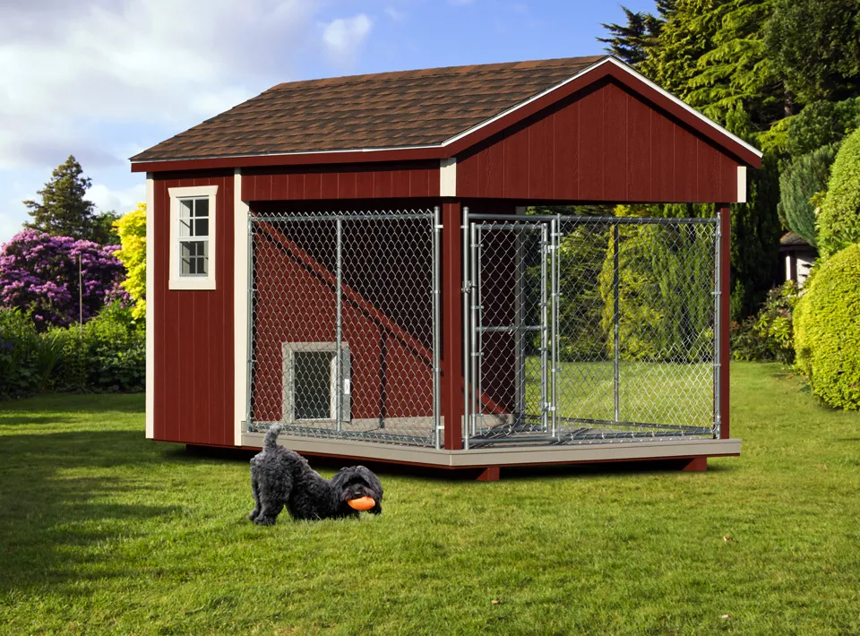 A large red 8x12 Amish dog kennel with a spacious outdoor run, set against a green lawn and trees.