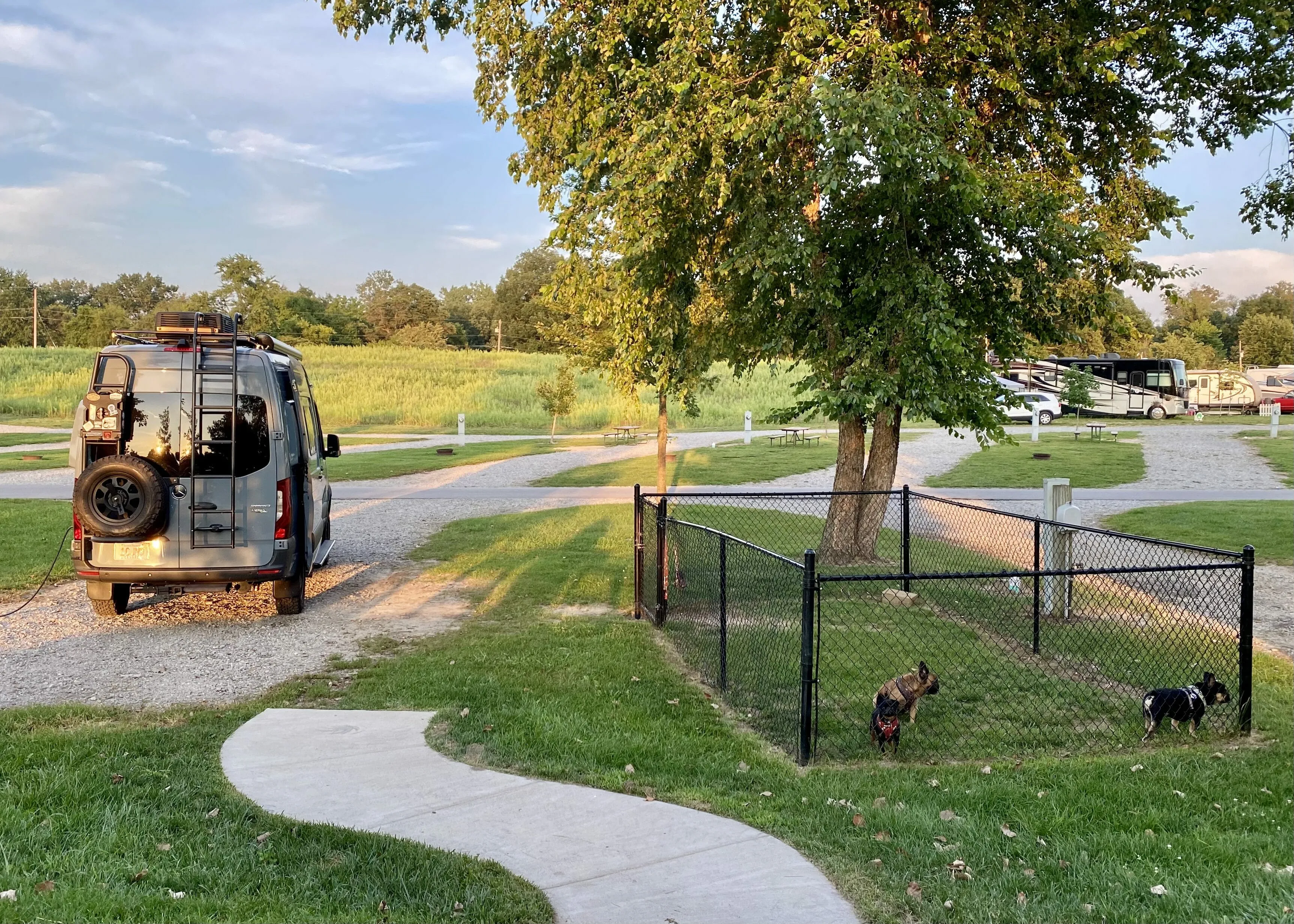 A large, well-appointed back-in dog pen campsite at Angola / Hogback Lake KOA Holiday