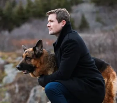 A majestic German Shepherd dog, alert and loyal, standing outdoors