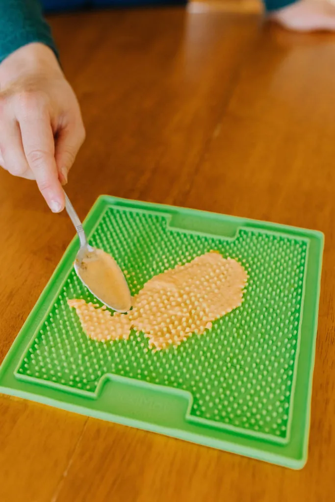 A prepared Lickimat Soother with pumpkin and yogurt spread