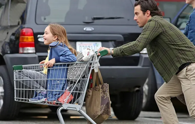 A race car driver and his loyal dog, symbolic of their journey