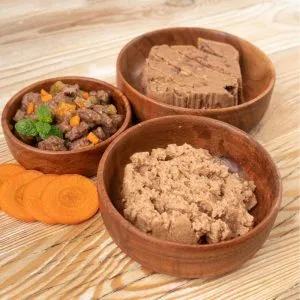 A serving of moist wet dog food in a bowl