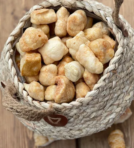 A small, remaining piece of a Yakers dog chew being microwaved until it puffs up into a crunchy treat.