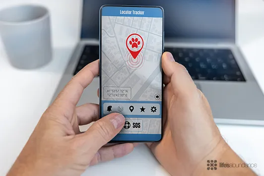 A smartphone displaying a pet lost and found app, highlighting innovations in pet safety and care