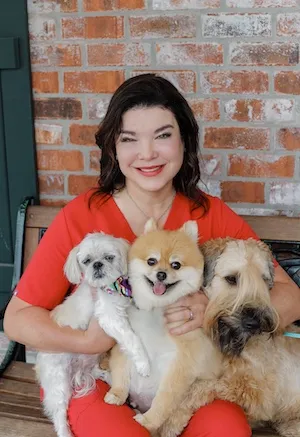 A team of six veterinarians in a professional setting, ready to care for pets