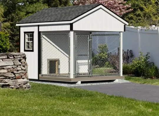 A traditional 8x10 Amish dog kennel in white, featuring an enclosed space and a spacious run