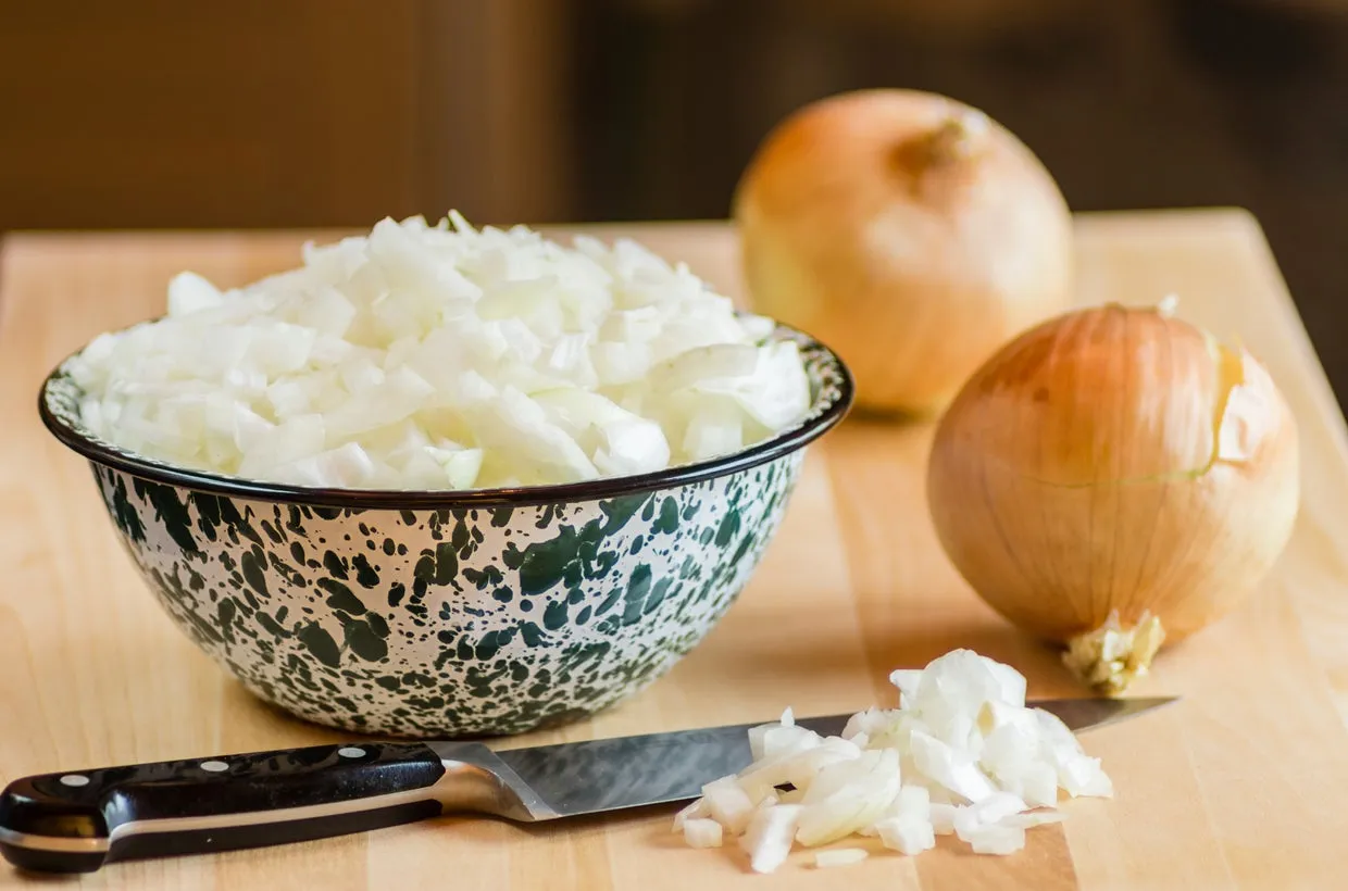 A variety of fresh onions, garlic, and leeks, which belong to the Allium genus and are toxic to pets.