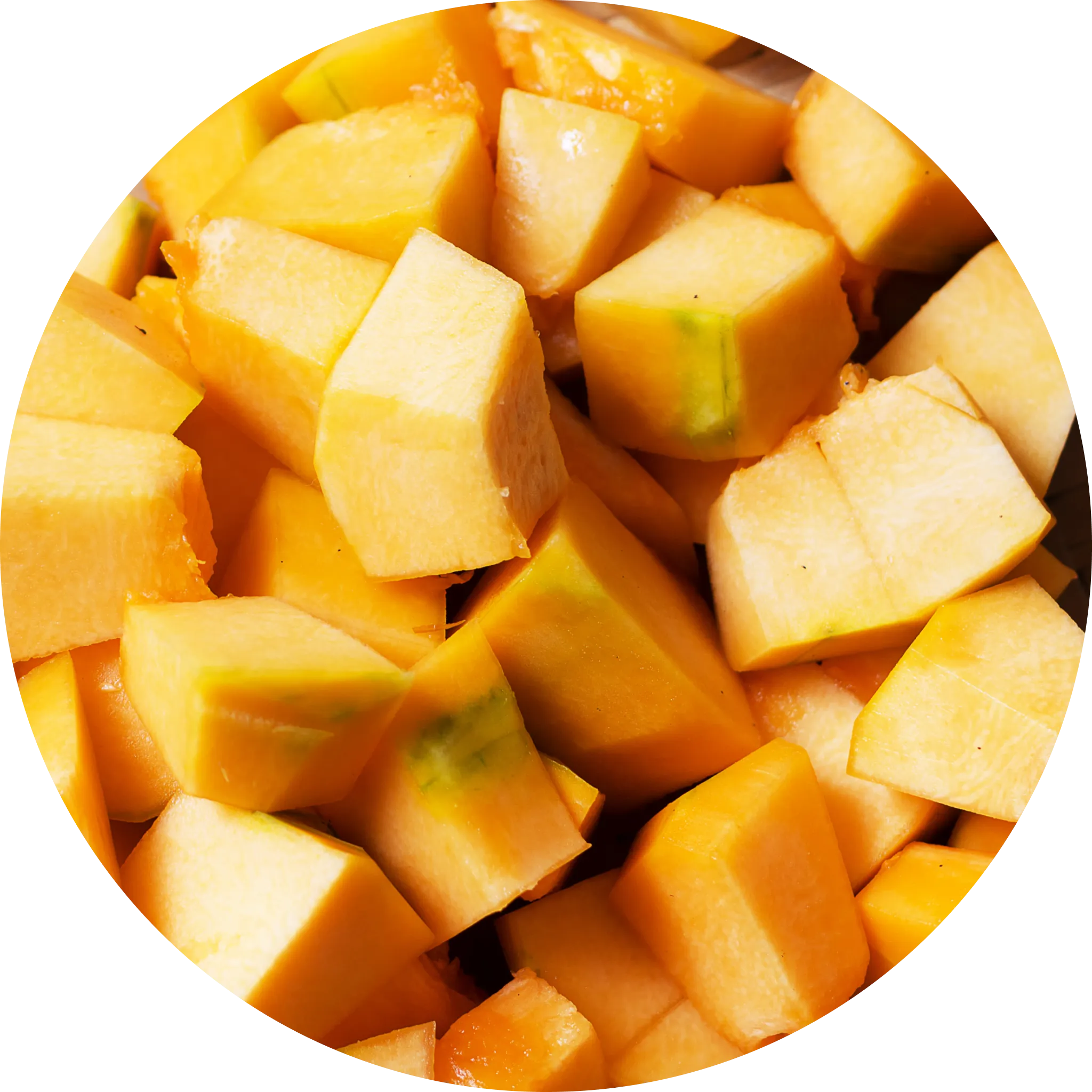 A vibrant, round orange pumpkin displayed prominently on a rustic wooden surface