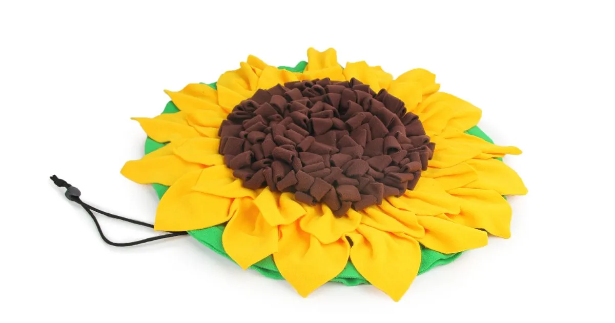 A yellow and green sunflower-shaped snuffle mat for dogs.