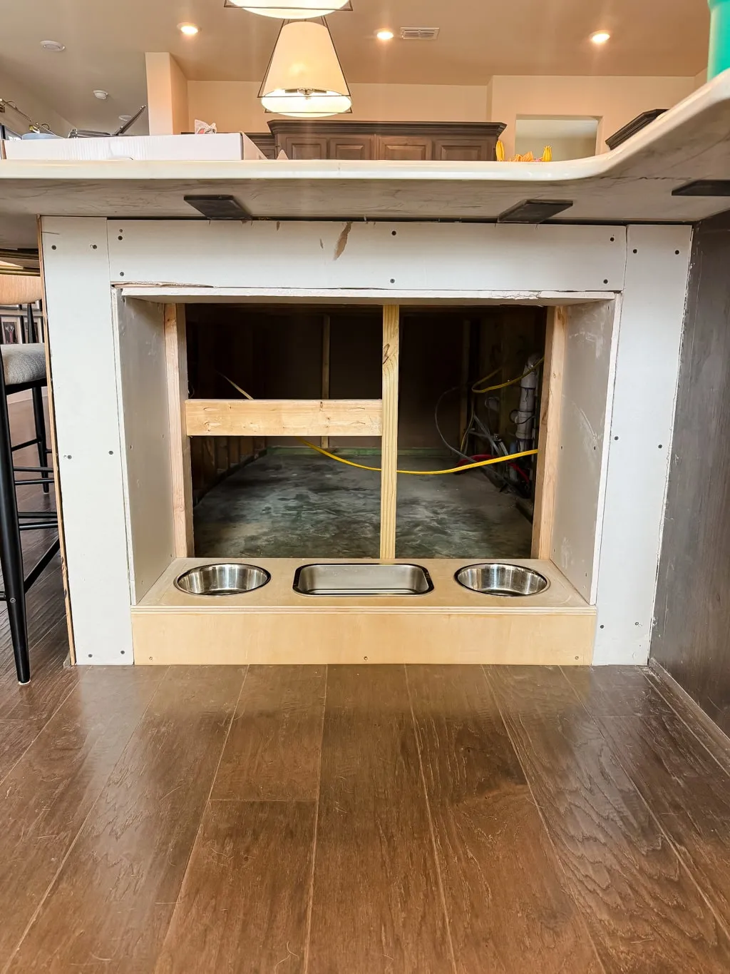 Adding drywall to the internal frame of a built-in dog feeding station