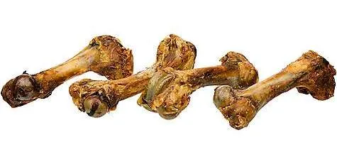 An assortment of commercially packaged bone treats for dogs, including ham bones and knuckle bones