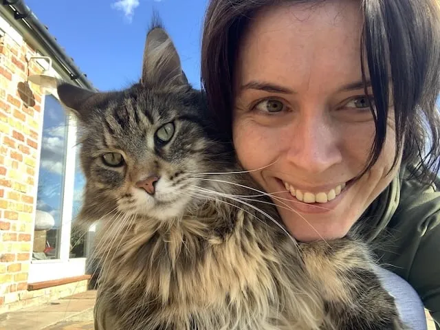 Bali the Maine Coon cat and Katrina Stewardson. Female holding big cat!