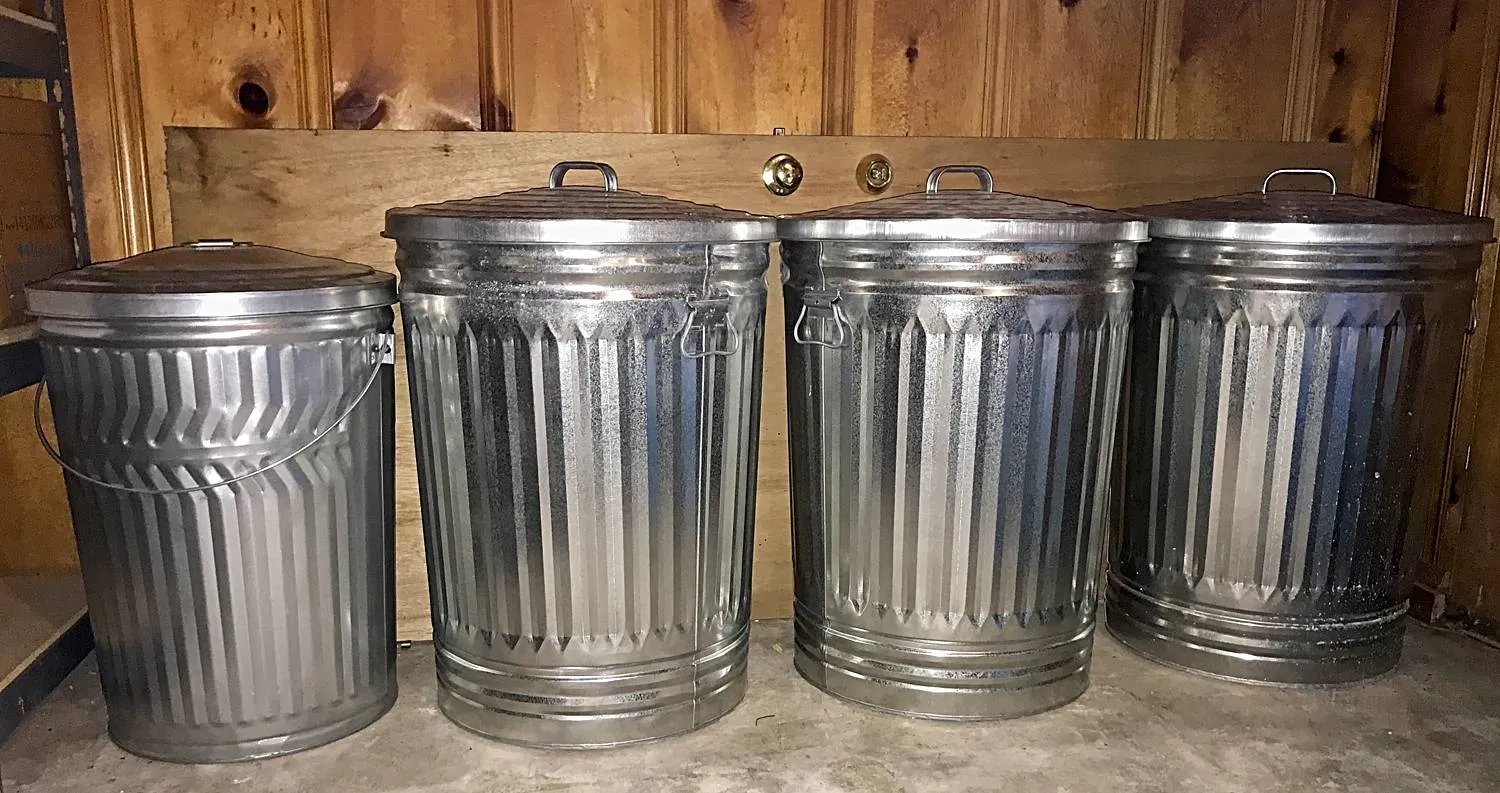 Birdseed and Peanuts Stored in Galvanized Metal Cans