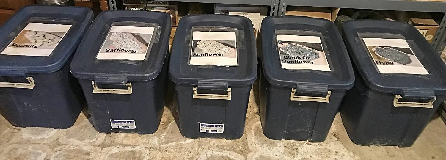 Birdseed Stored in Large Plastic Storage Containers