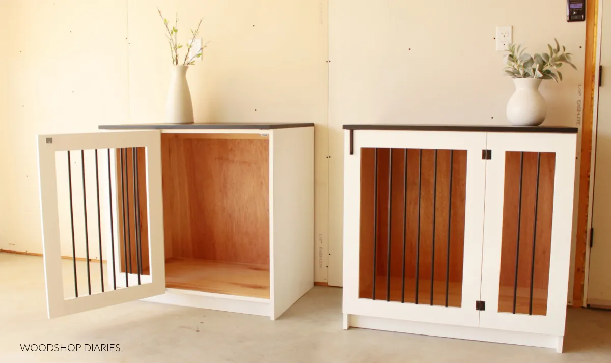 Black and White DIY wooden dog crates sitting side by side with one door open
