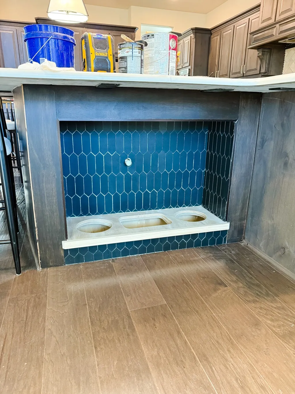 Building a plywood countertop for a built-in dog feeding station, showing the stained wood