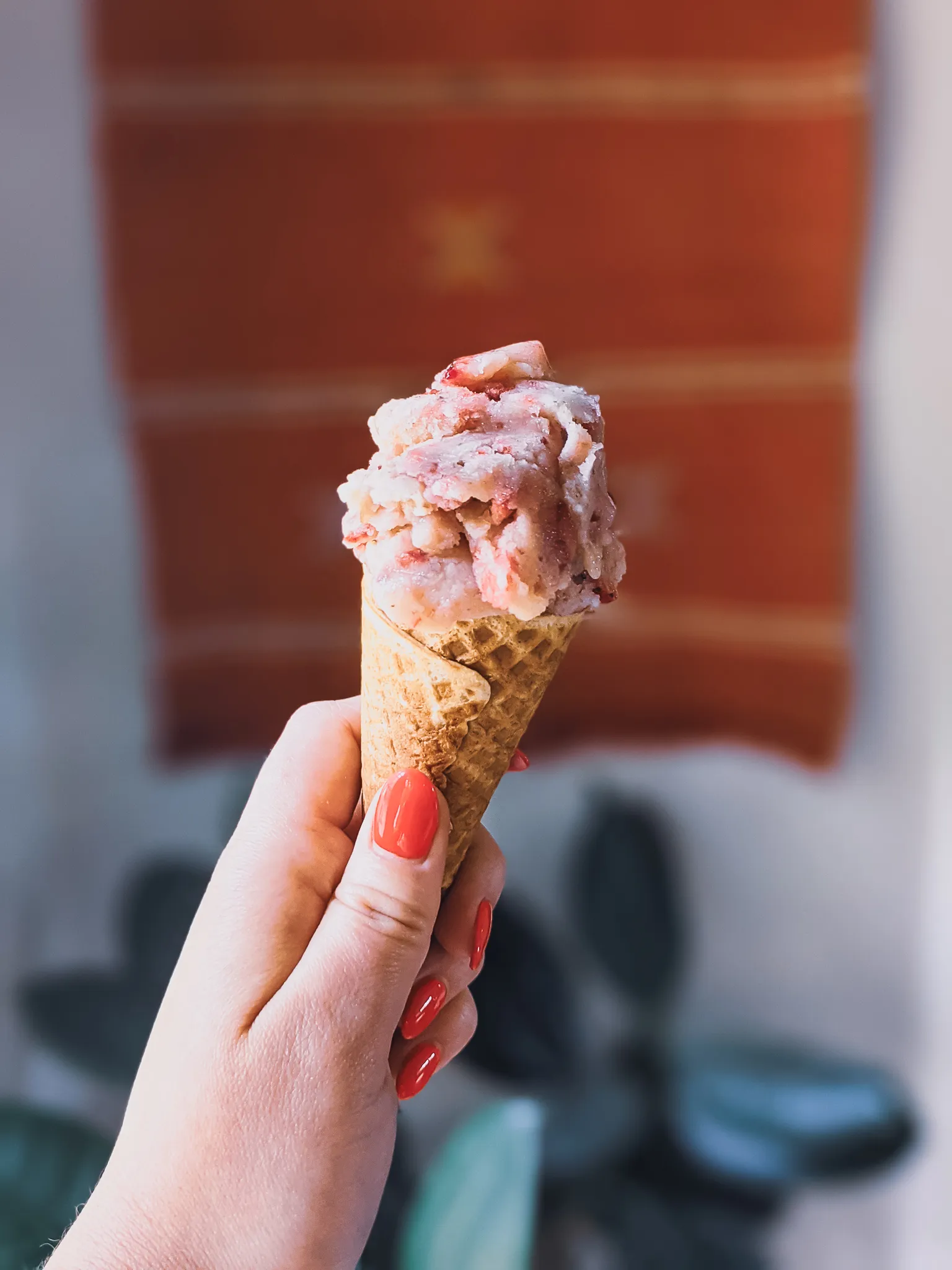 Close-up of a dog-friendly ice cream mixture being scooped from a blender, showing a smooth, creamy texture.