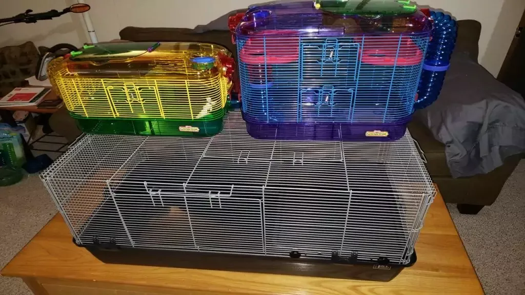 CritterTrail cages stacked on top of the larger Prevue 528 Small Animal Cage for size comparison