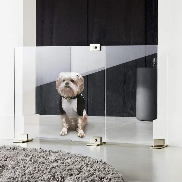 Decorative pet gate blocking access to a modern couch