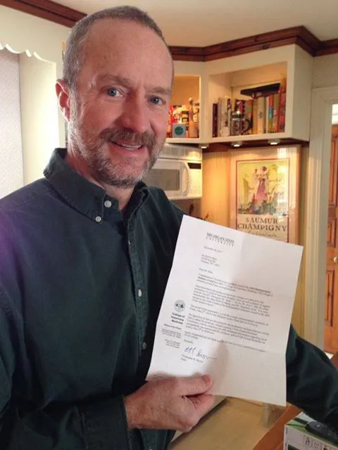 Dr Stein receiving award