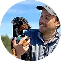 Founder Ryan with his dog, demonstrating a DoggoRamp product.