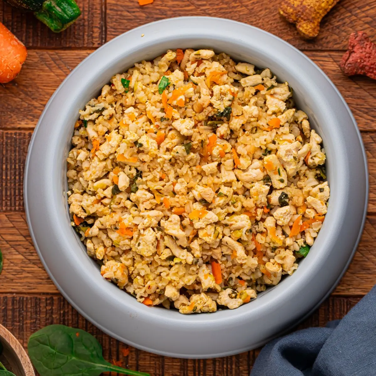 Freshly prepared homemade turkey and rice dog food with vegetables in a bowl, ready for a happy pup.