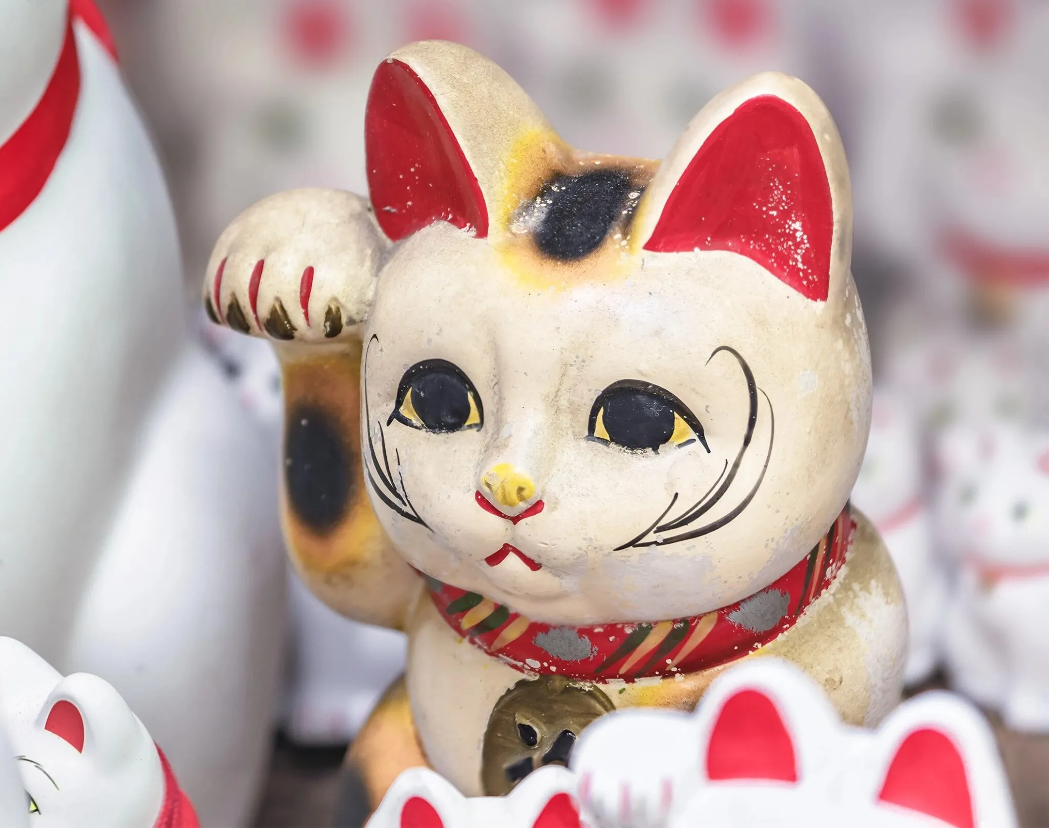Japanese Maneki Neko figurines with calico patterns