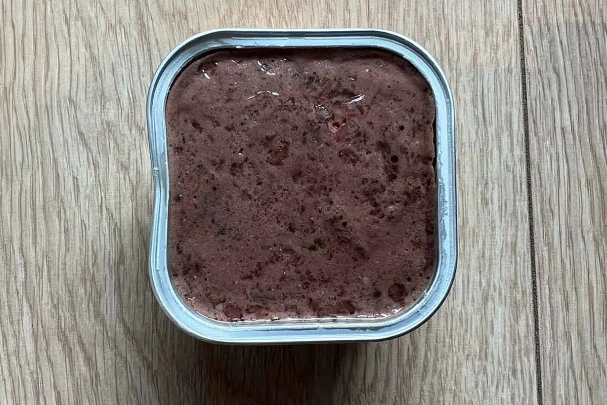 Lily's Kitchen dry food and wet food varieties displayed on a wooden surface