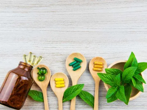 Owner giving a dog a supplement