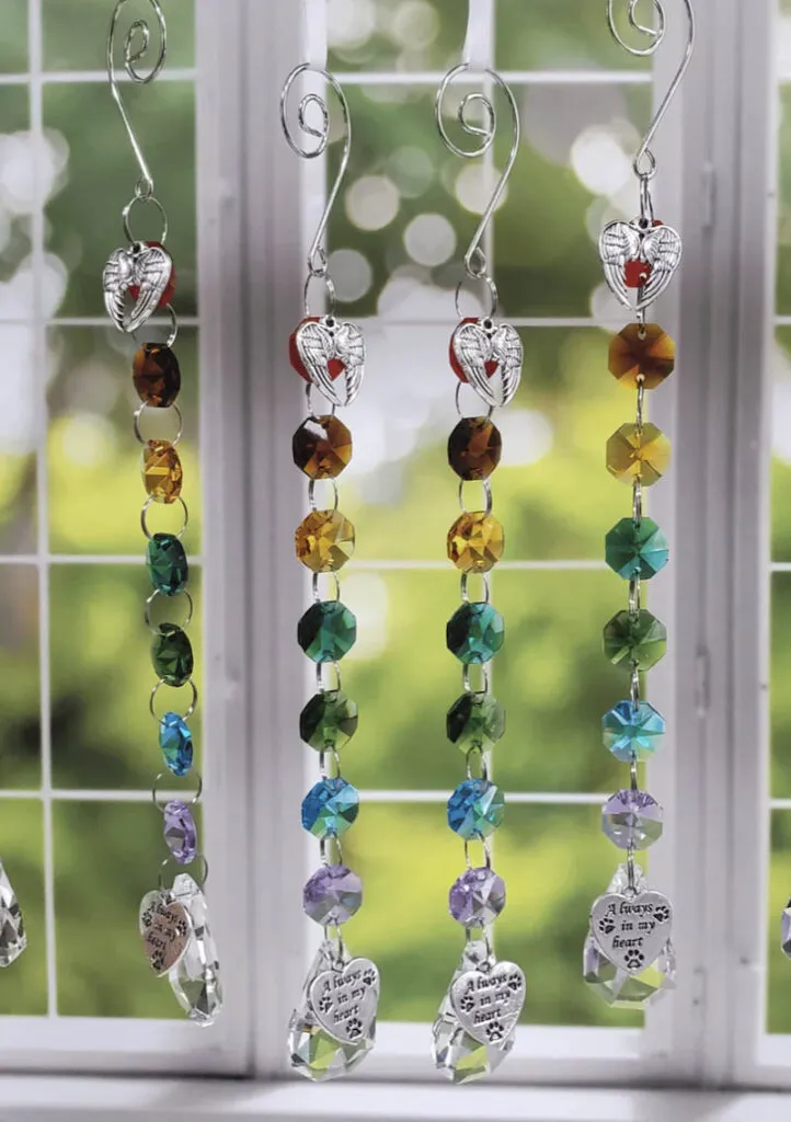 Pet loss gift sun catcher creating rainbows through the window