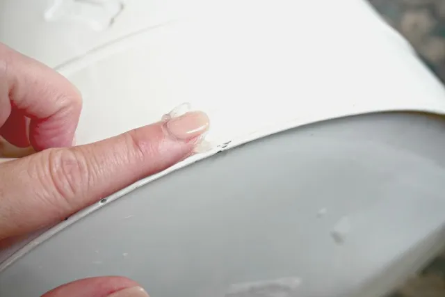 Petroleum jelly applied to the bottom rim of a dog food storage bin